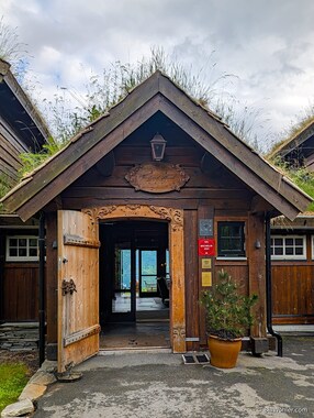 The entrance to the hotel has the character of a summer farm.