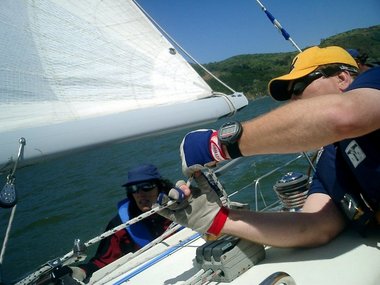 Lori and Greg concentrate on their sail trim